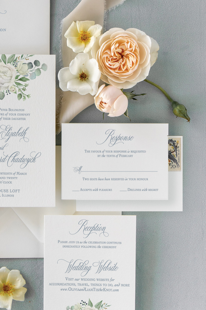 Rsvp card for Chicago Wedding with dusty blue ink and blush flowers.