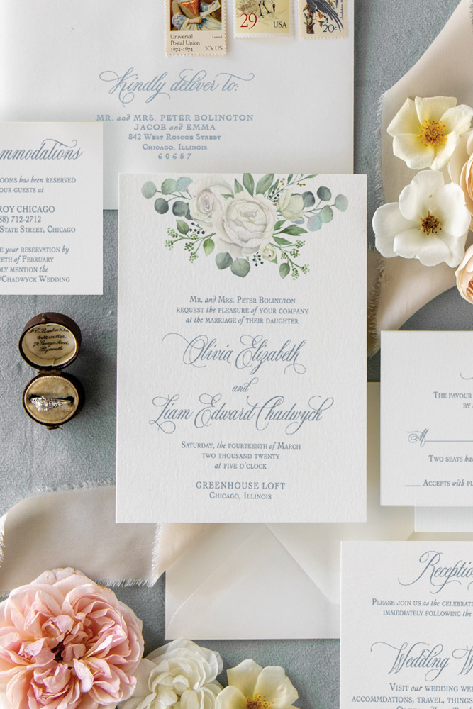 Rose and eucalyptus watercolor wedding invitation at Greenhouse Loft in Chicago with dusty blue ink.